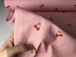 Bomuldsjersey - flotte kirsebær på lyserød bund, gots